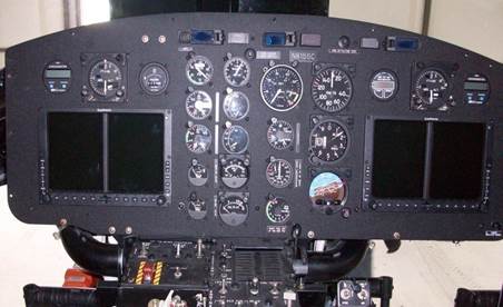 A Control Panel With Different Dial Indicators in a Helicopter
