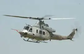 A White and Grey Color Helicopter Flying in the Air