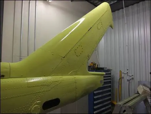 A Yellow Color Painted Tail Wing of a Helicopter