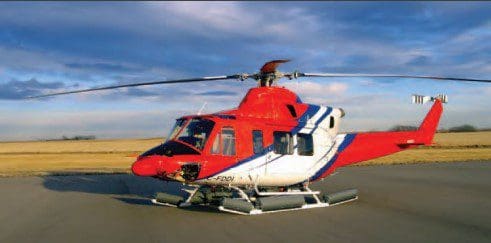 A red helicopter with a blue and white stripe on it.