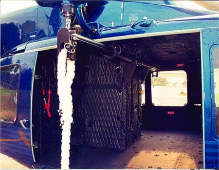 A blue truck with chains on the side of it.