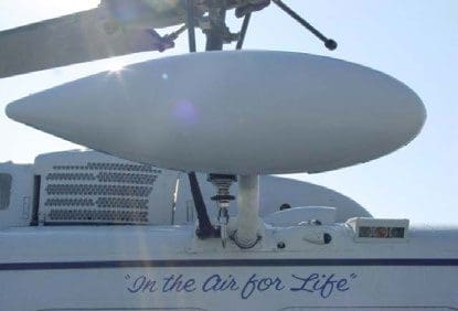 A white boat with the words " in the air for life ".